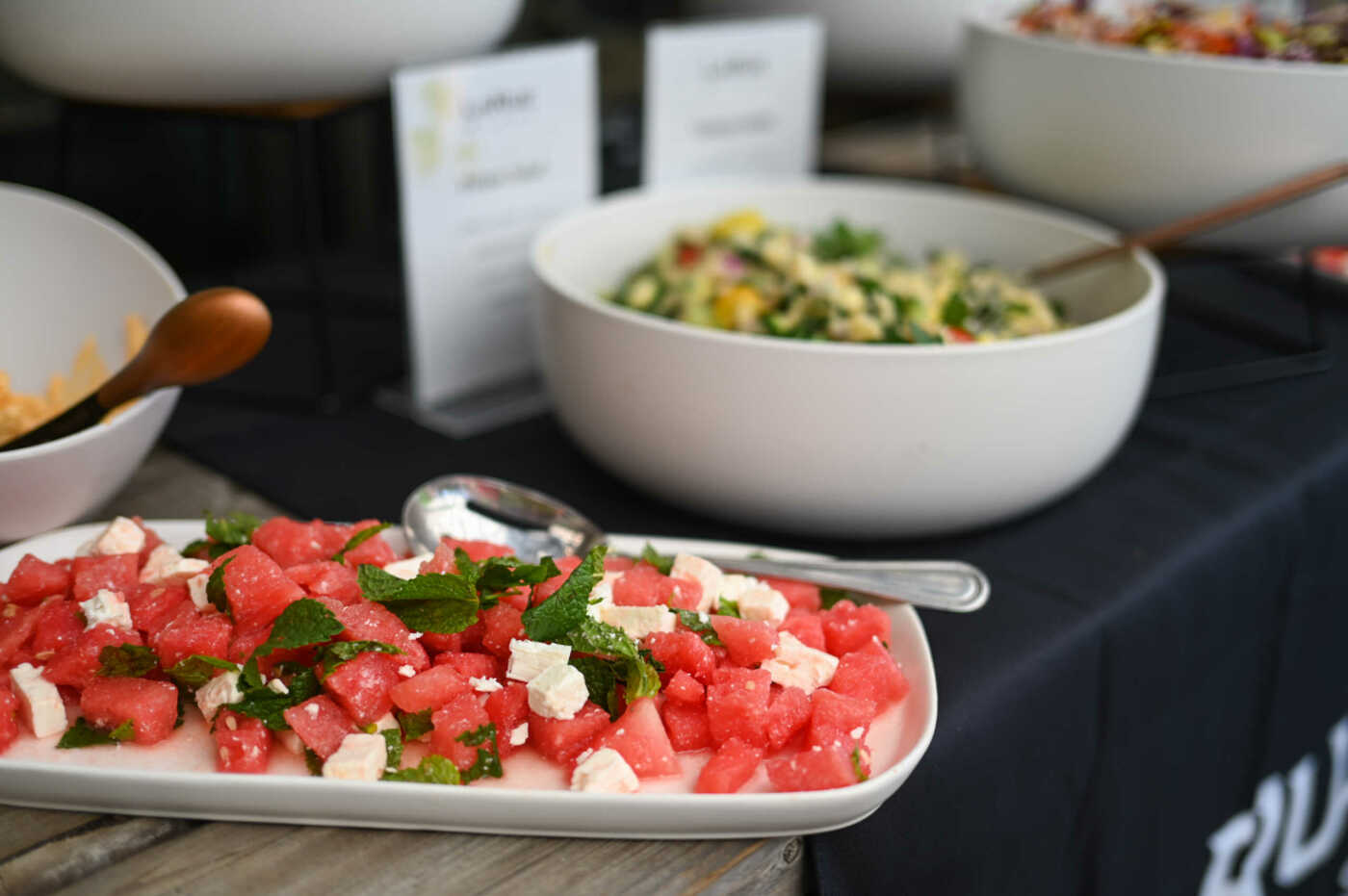Watermelon and feta salads on a table.
